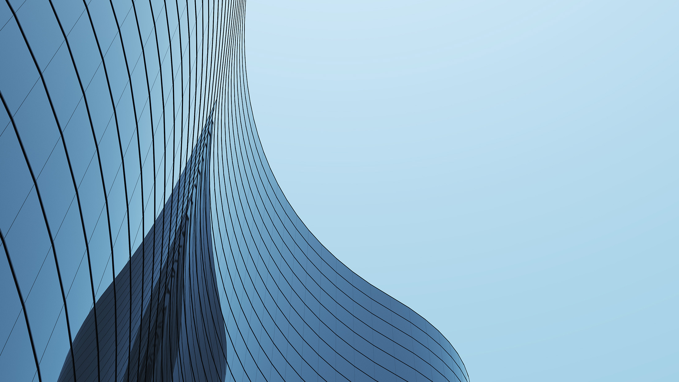High rise curve glass building and dark steel window system on blue clear sky background