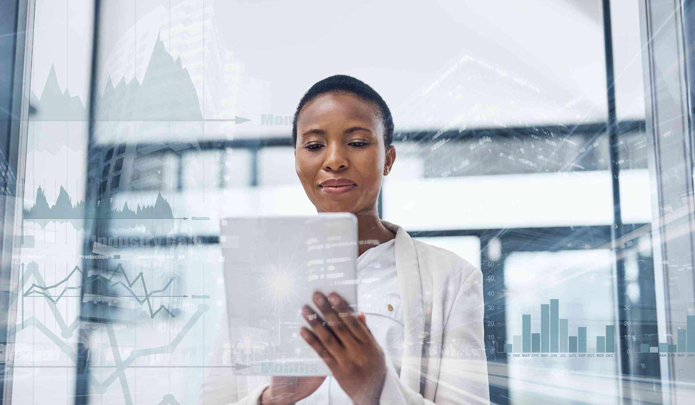 Woman looks intently at a tablet computer