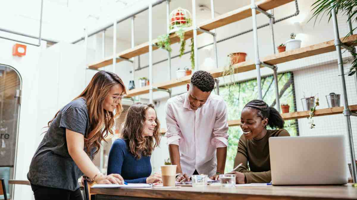 Employees having a discussion around the table