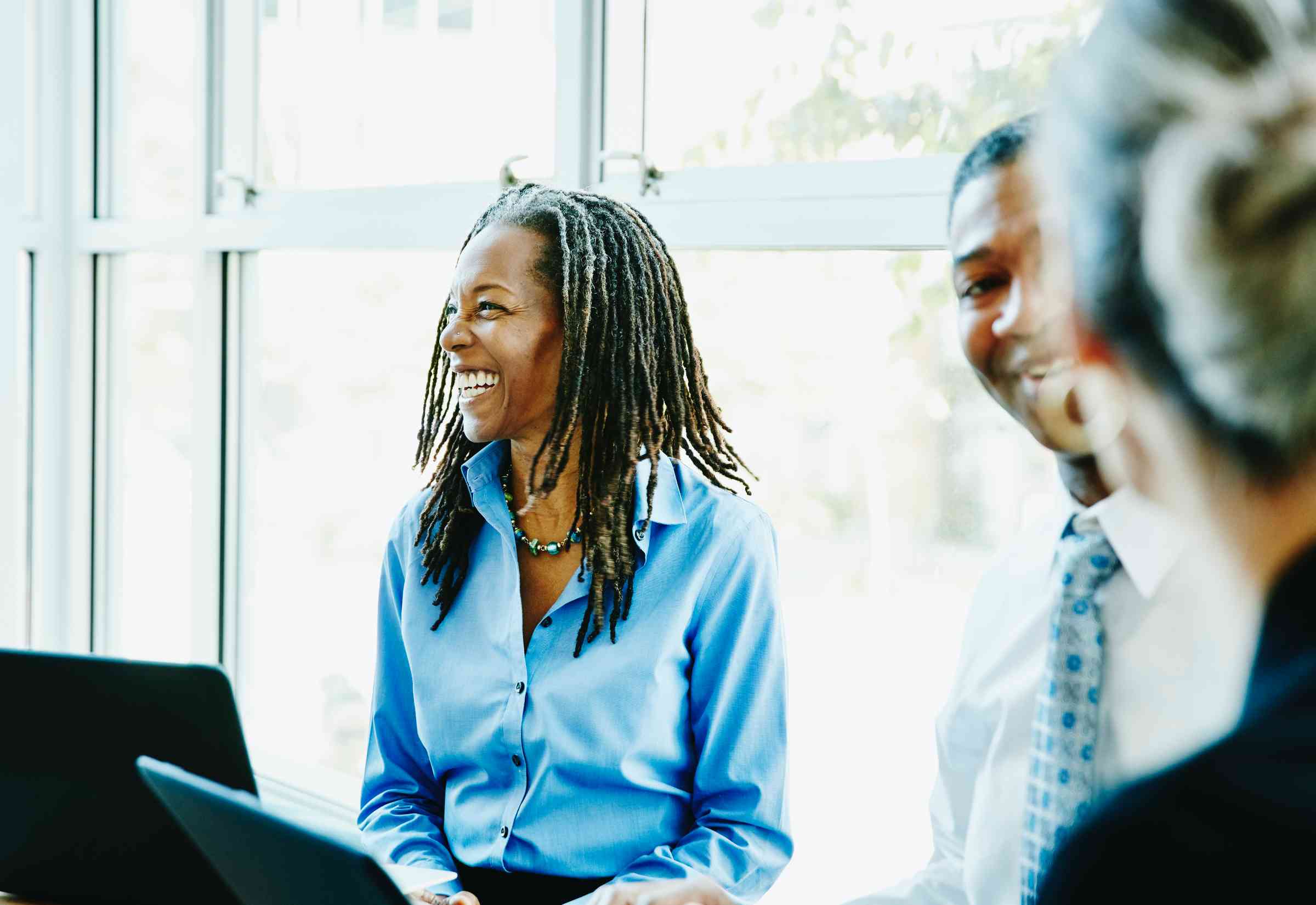 Woman laughing in office