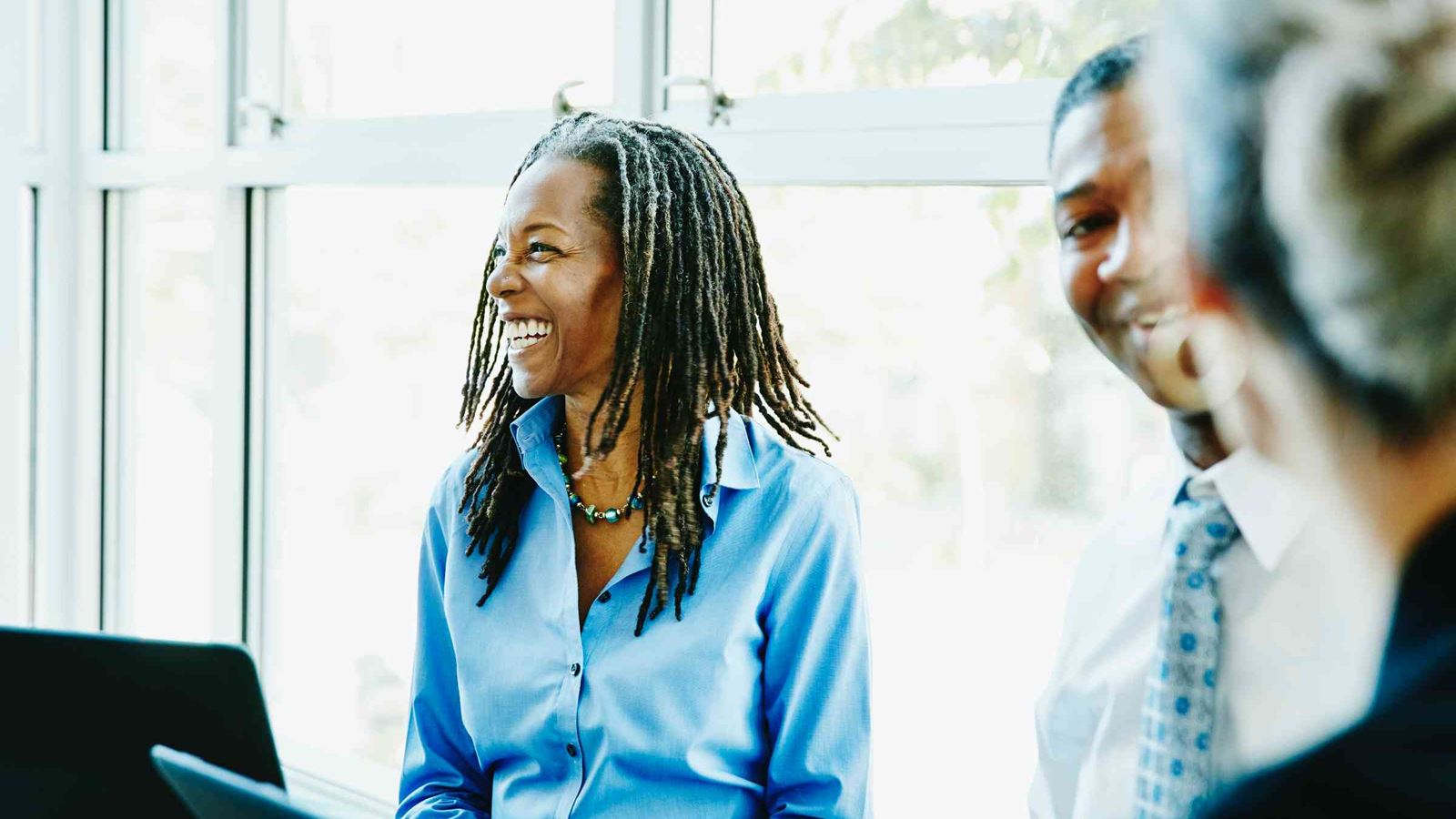 Woman laughing in office