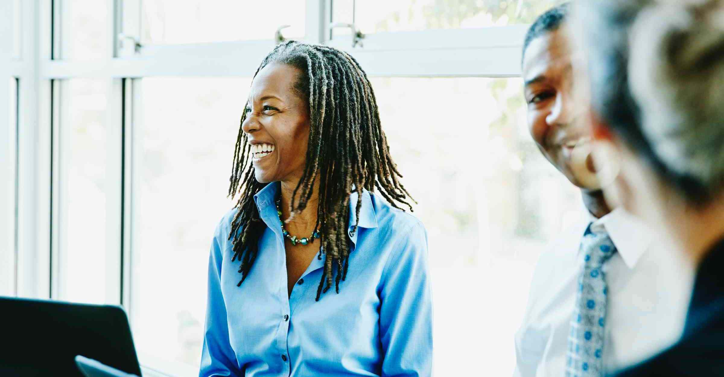 Woman laughing in office