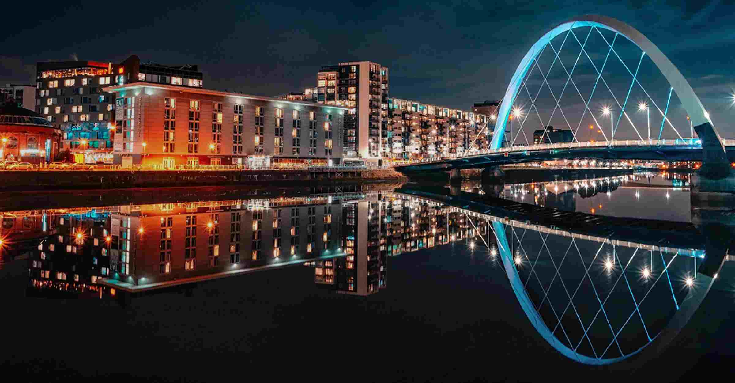 Night view of a bridge and a group of buildings in Scotland