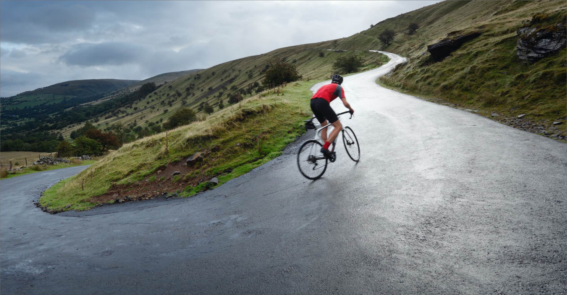 Man cycling up a hill