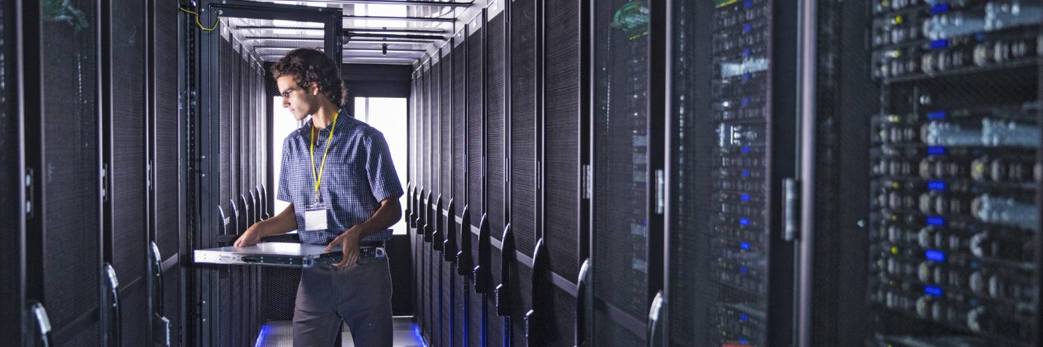 Technician in a data center server farm