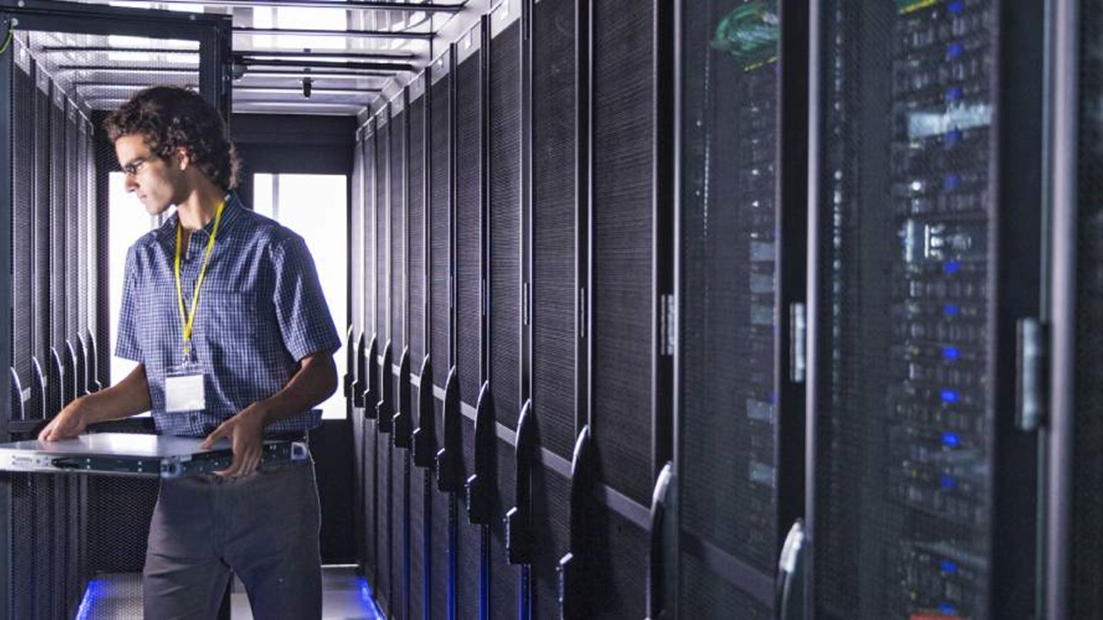 Technician in a data center server farm