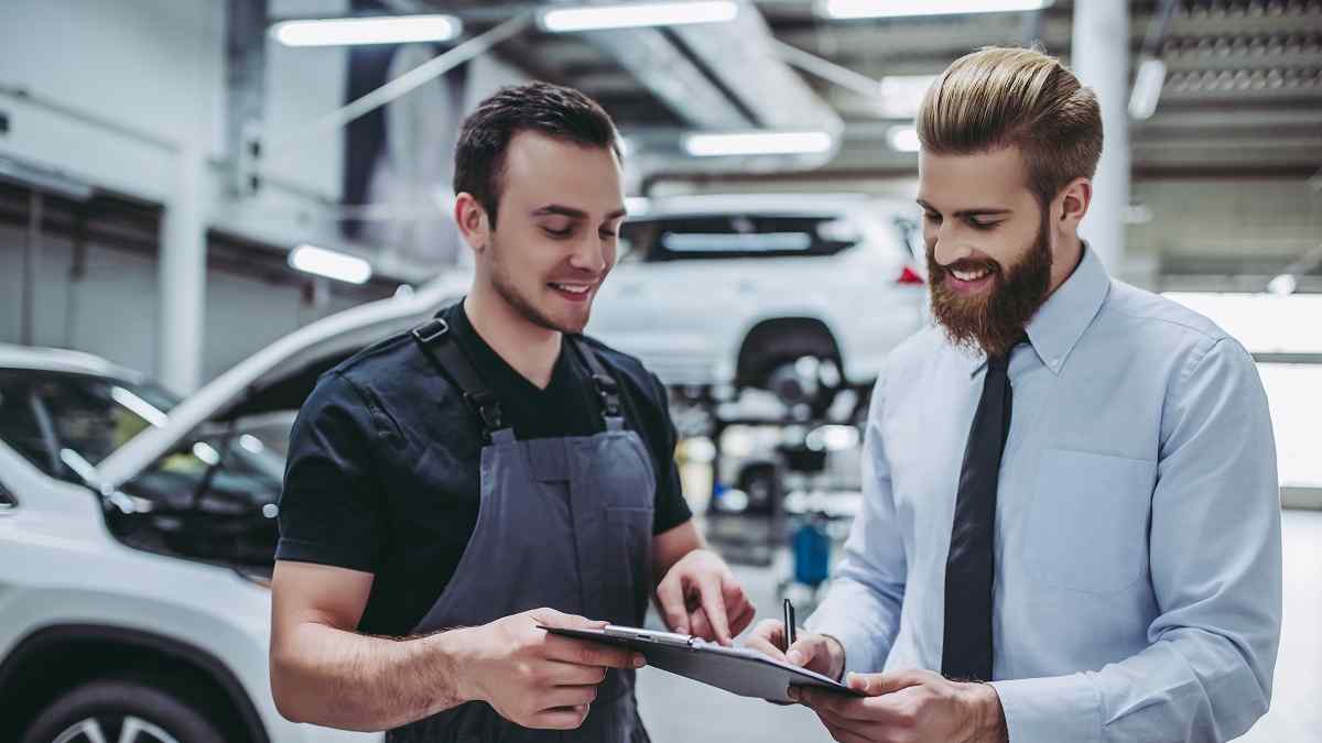 Two men at car sales office