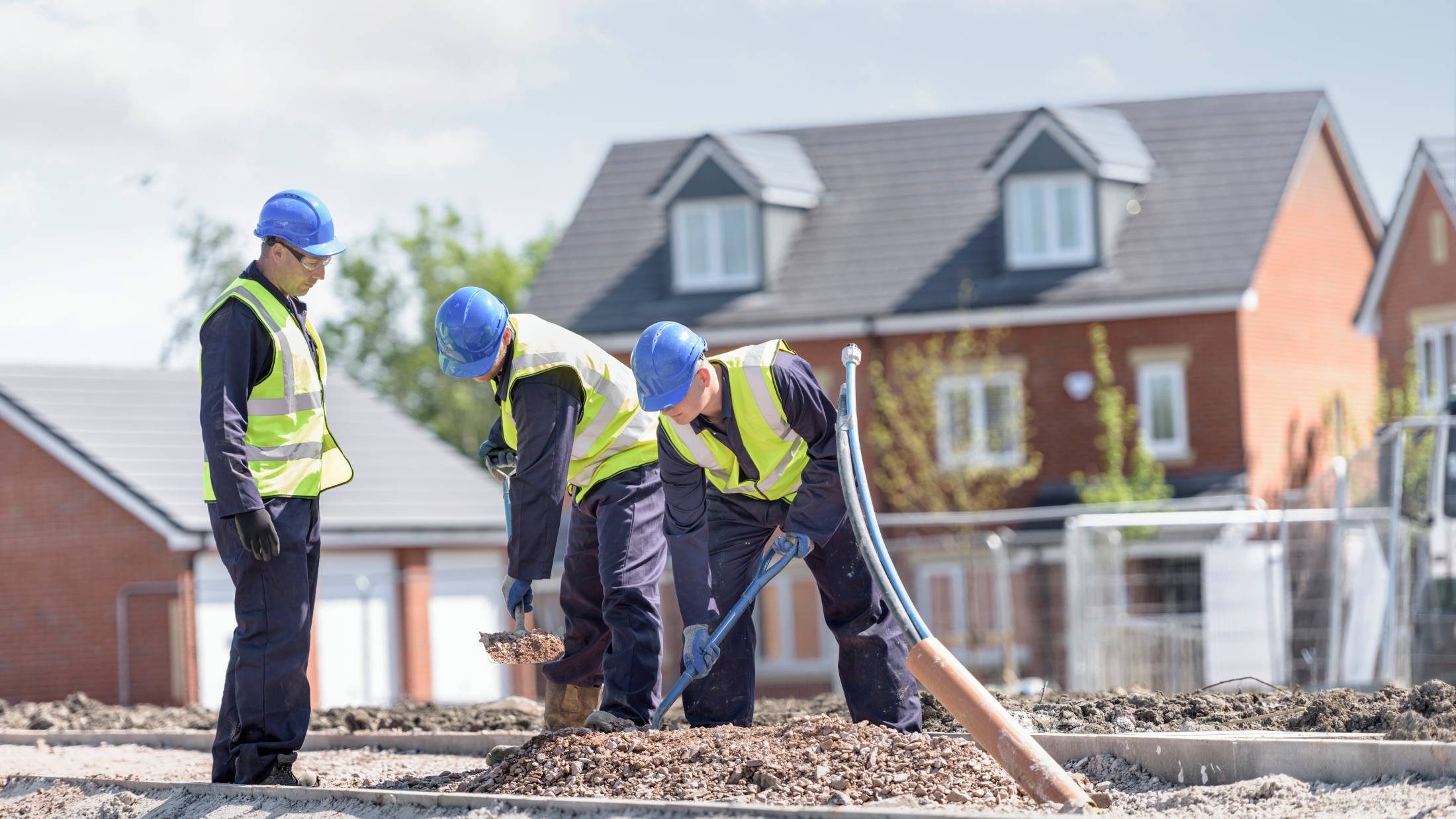 Three contractors on a building site