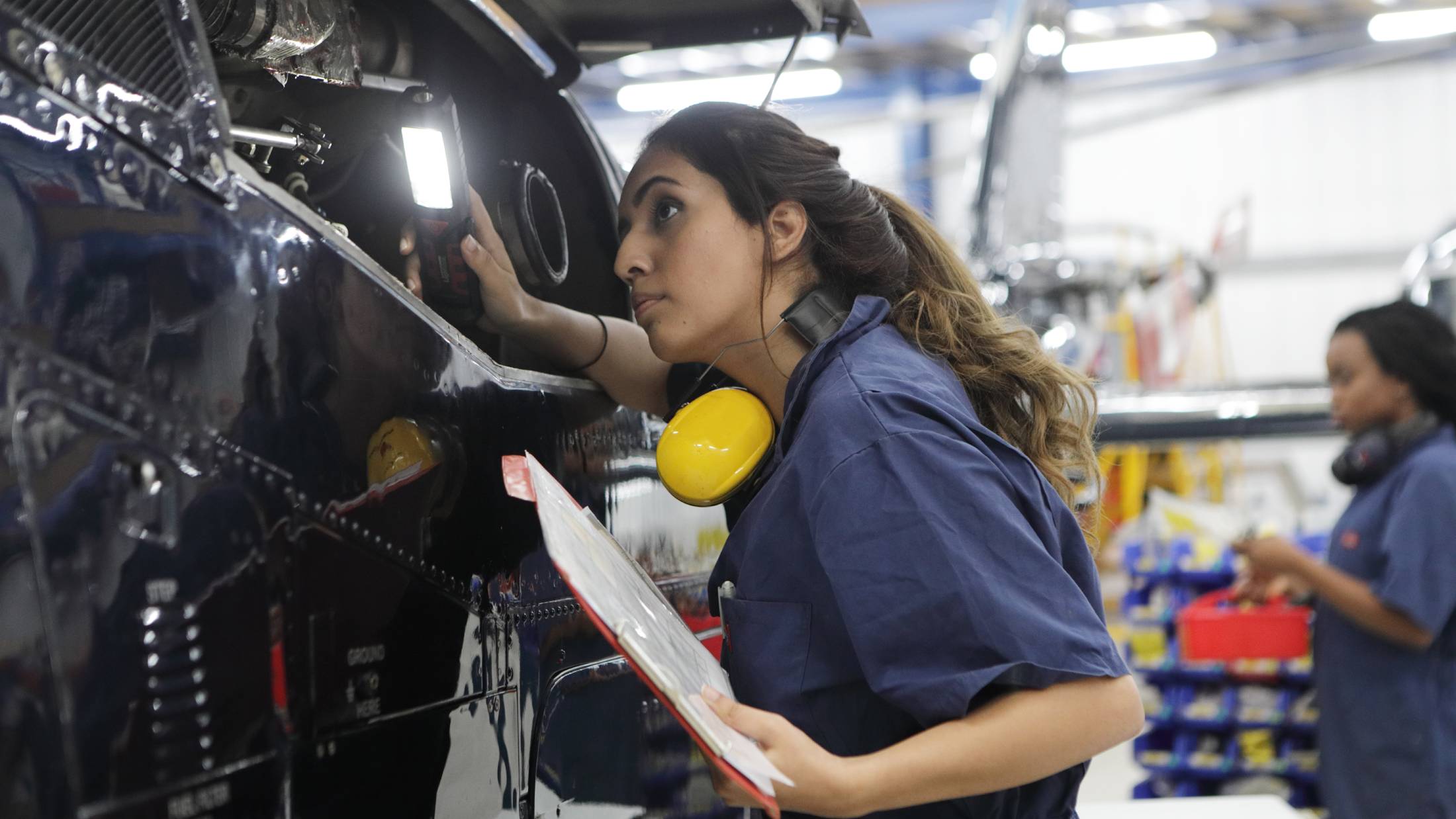 Engineer inspecting a car