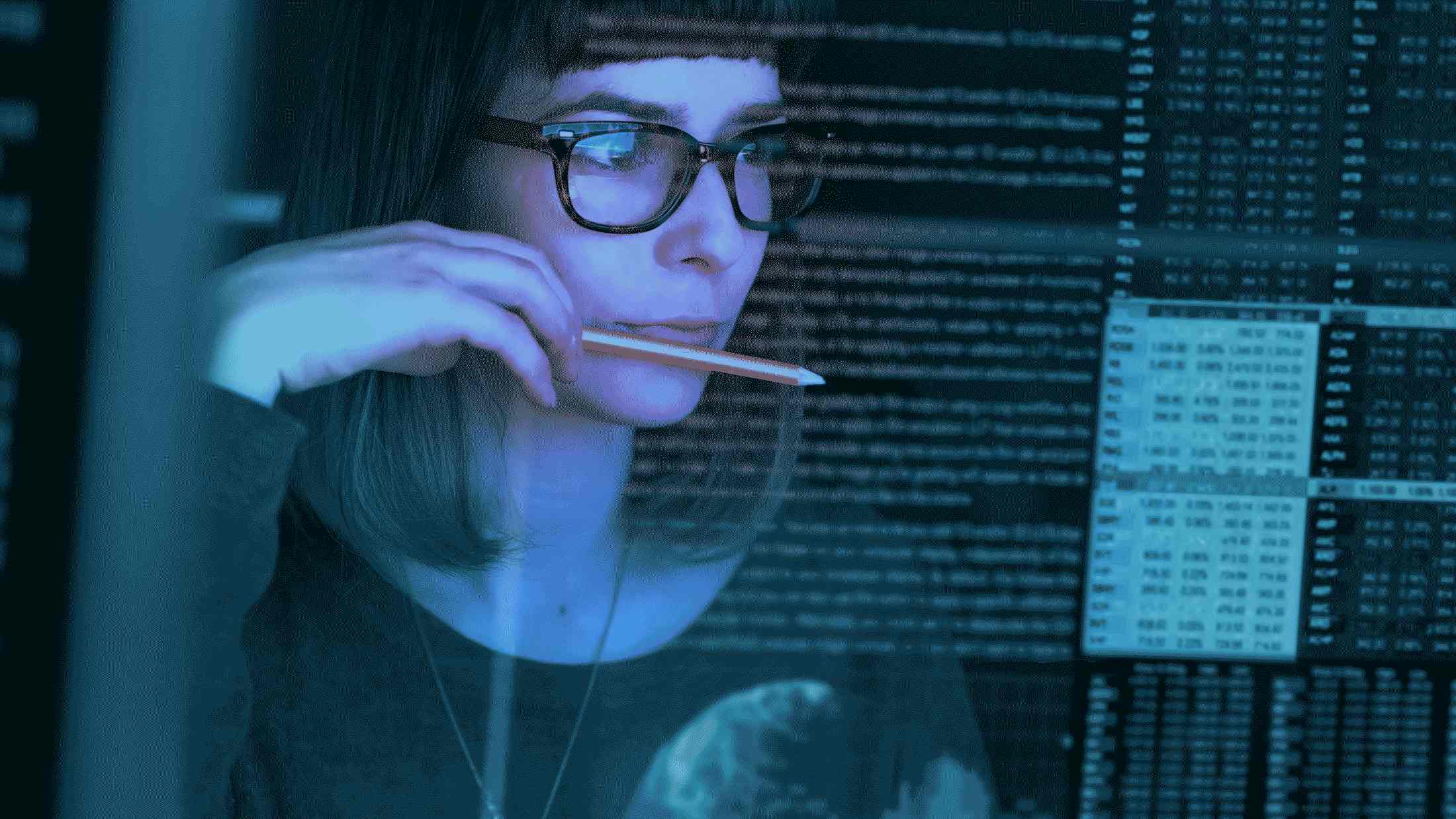 Woman looking at data on a computer screen