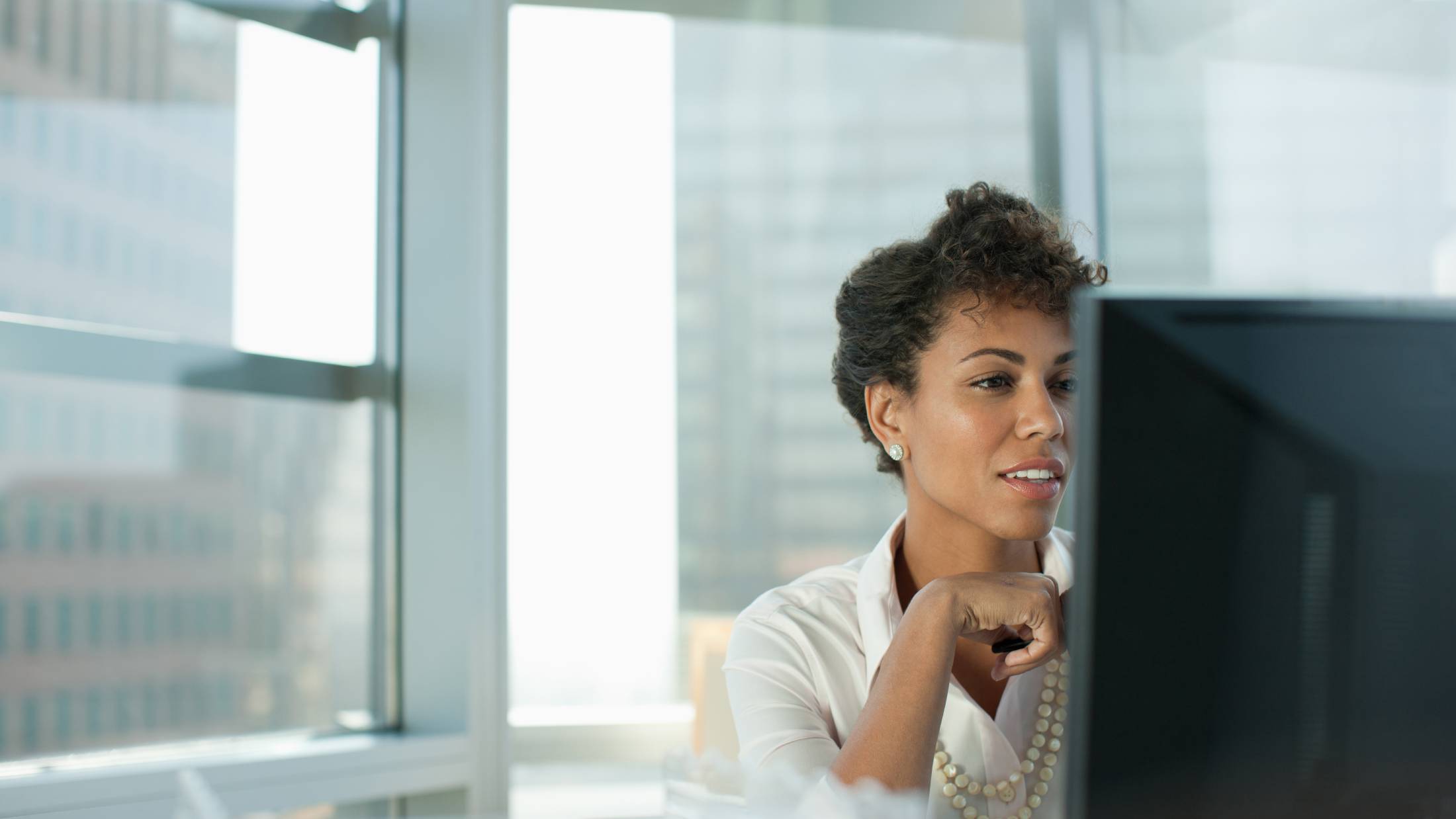 Woman looking at a computer